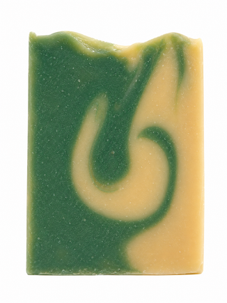 Bar of soap with green and beige swirl pattern on a white background