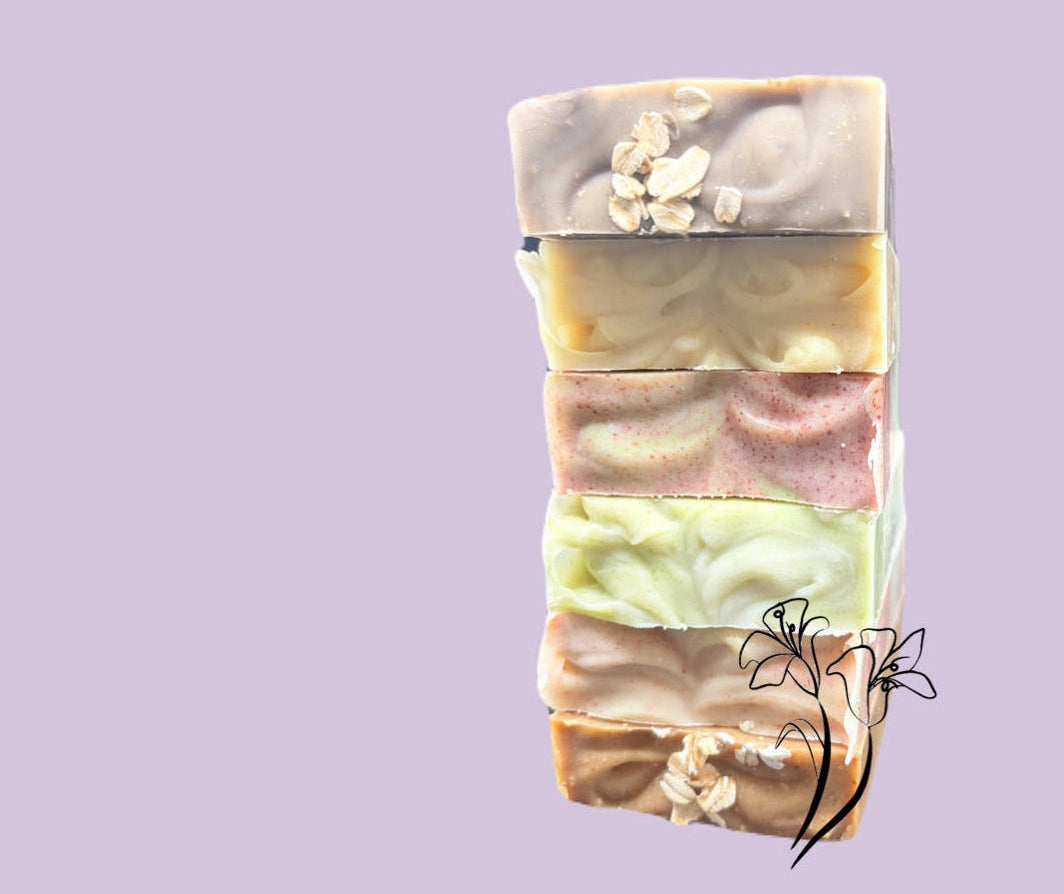 Stack of layered soap bars on a light purple background